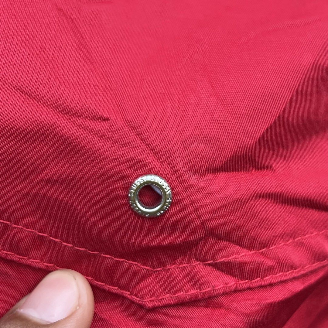 Stussy Red Nylon Shorts Size M (Category: Shorts) located in Davao. Submitted by streetsight (Listing ID 1470298681, Image 2). Description: - Brand: Stussy - Color: Bright Red - Size: Medium (M) - Material: Lightweight nylon, ideal for casual wear - Waistband: Elastic with stylish patterned trim detail - Branding: Small embroidered signature logo near hem and Stussy-embossed metal eyelets - Condition: Brand new with inner tags attached.