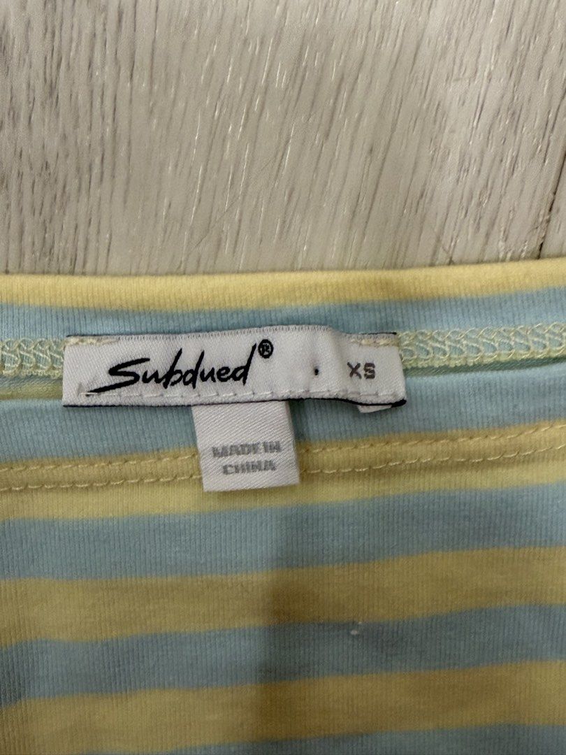Subdued Striped Boat Neck Top XS (Category: Blouses) located in Manila. Submitted by genyfurrose (Listing ID 1470157112, Image 2). Description: - Size: XS (fits true to size) - Design: Subdued pastel yellow and light blue stripes with boat neck - Details: Relaxed batwing sleeves and fitted banded hem at the waist - Material: Lightweight, super soft, and comfy cotton blend - Condition: Worn once, basically flawless - Style tip: Pair with low-rise 