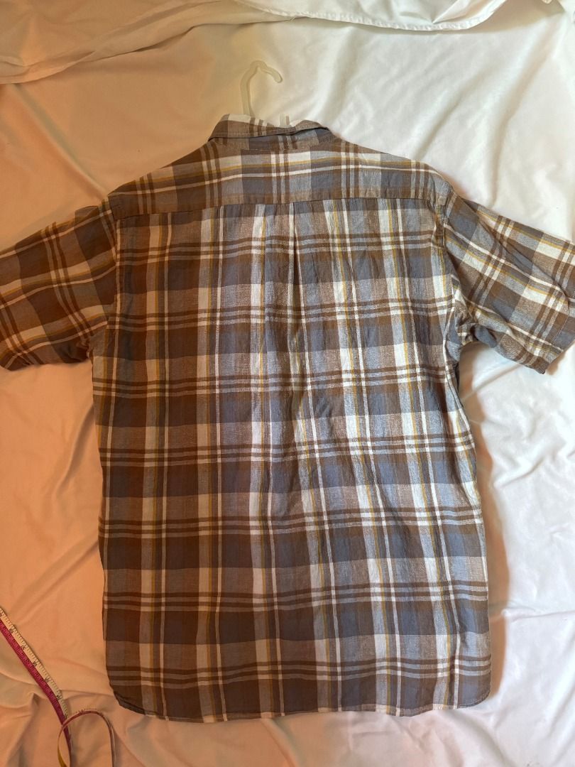 Sugar Cane Light Plaid Button Down Shirt Size L (Category: Tshirts & Polo Shirts ) located in Cebu City. Submitted by _t.rix (Listing ID 1470168669, Image 2). Description: - Brand: Sugar Cane Light - Style: Short-sleeve button-down shirt - Pattern: Brown, grey, and white plaid with yellow accent stripes - Features: Button-down collar, single chest pocket, curved hem - Size: L - Condition: Excellent, well-maintained - Mode of Payment: GCash - Ship