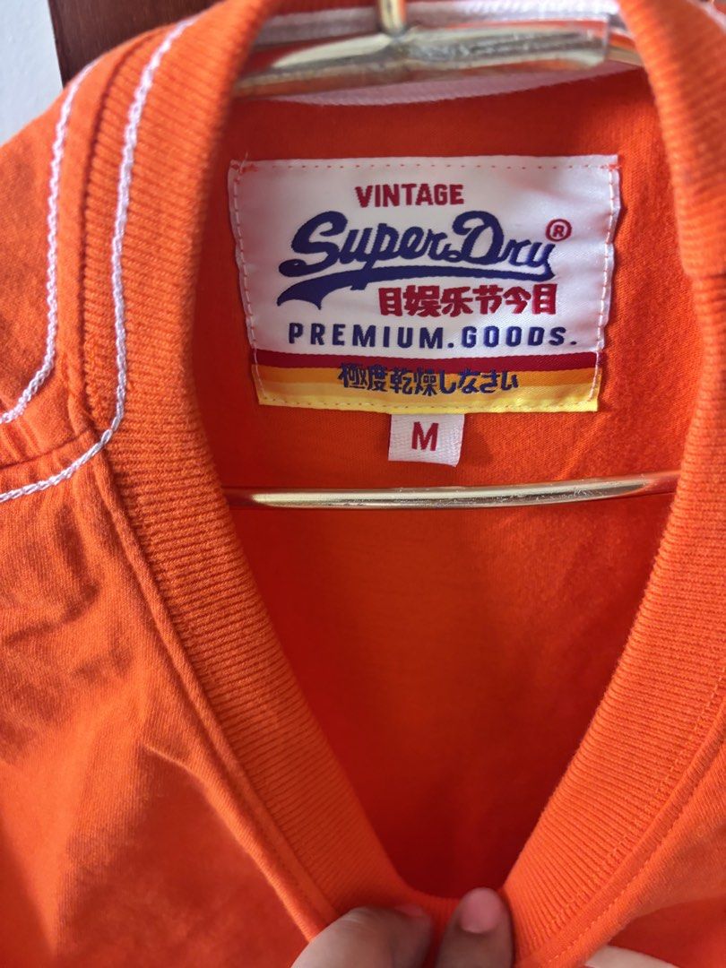 Superdry Orange Shirt (Category: Tshirts & Polo Shirts ) located in Manila. Submitted by minieiv._ (Listing ID 1470211404, Image 3). Description: * Pre-loved * Bought in Singapore * RFS: Decluttering * Meetup: Puregold San Mateo, Ampid Mercury.