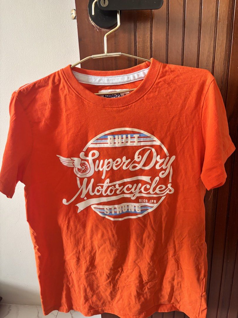 Superdry Orange Shirt (Category: Tshirts & Polo Shirts ) located in Manila. Submitted by minieiv._ (Listing ID 1470211404, Image 1). Description: * Pre-loved * Bought in Singapore * RFS: Decluttering * Meetup: Puregold San Mateo, Ampid Mercury.