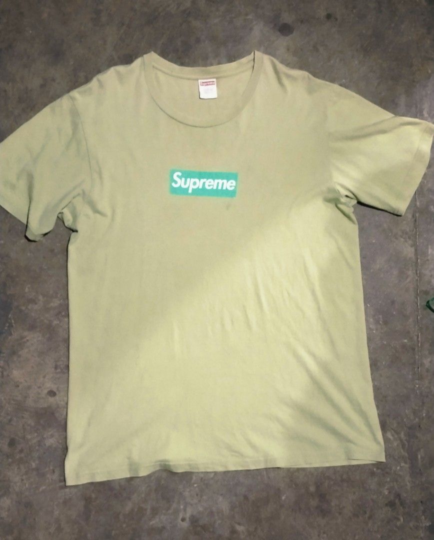 Supreme Green Box Logo T-Shirt (Category: Tshirts & Polo Shirts ) located in Caloocan City. Submitted by alihpena1906427 (Listing ID 1470301287, Image 1). Description: - Brand: Supreme - Item: Box Logo T-Shirt - Colorway: Pale Green with Bright Green/White Logo - Size: Large (True to size) - Material: 100% Pre-shrunk Cotton (Made in U.S.A.) - Condition: Neck tag and wash tag clearly attached - Style: Casual streetwear staple.