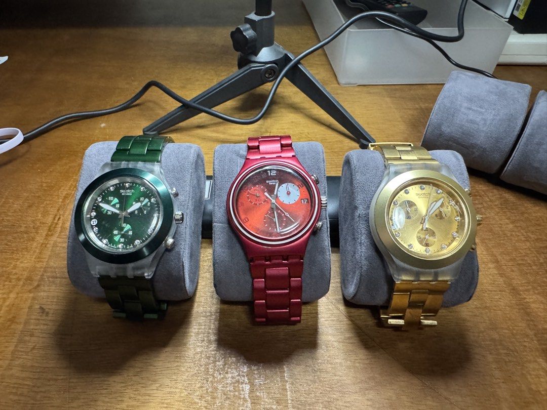 Swatch Chronograph Watch - Green, Red, Gold (Category: Women's Watches) located in Valenzuela. Submitted by wisetree_18aeb6 (Listing ID 1470183793, Image 1). Description: - Swiss-made Swatch chronograph watches: Green, Metallic Red, and Gold - Features stylish metal bracelets - Crystal accents on the green and gold watch dials - Reliable Swiss quartz movements - Minor scuffs on the clasps due to regular wear - Available for purchase as individual