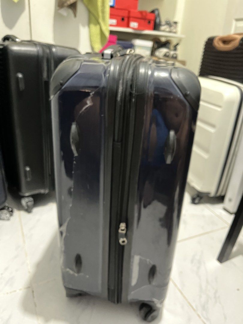 Swiss military luggage (Category: Luggage) located in Marikina City. Submitted by patpatndls (Listing ID 1470323450, Image 3). Description: - Brand: Swiss Military - Type: Hardcase Luggage / Medium Size (approx. 23-24 inches) - Color: Dark Blue / Black - Condition: 7/10 (shows minor exterior scuffs/stickers from travel, zippers and wheels work great, interior is clean) - Features: Durable hardshell exterior, secure inner cross straps, multiple zi
