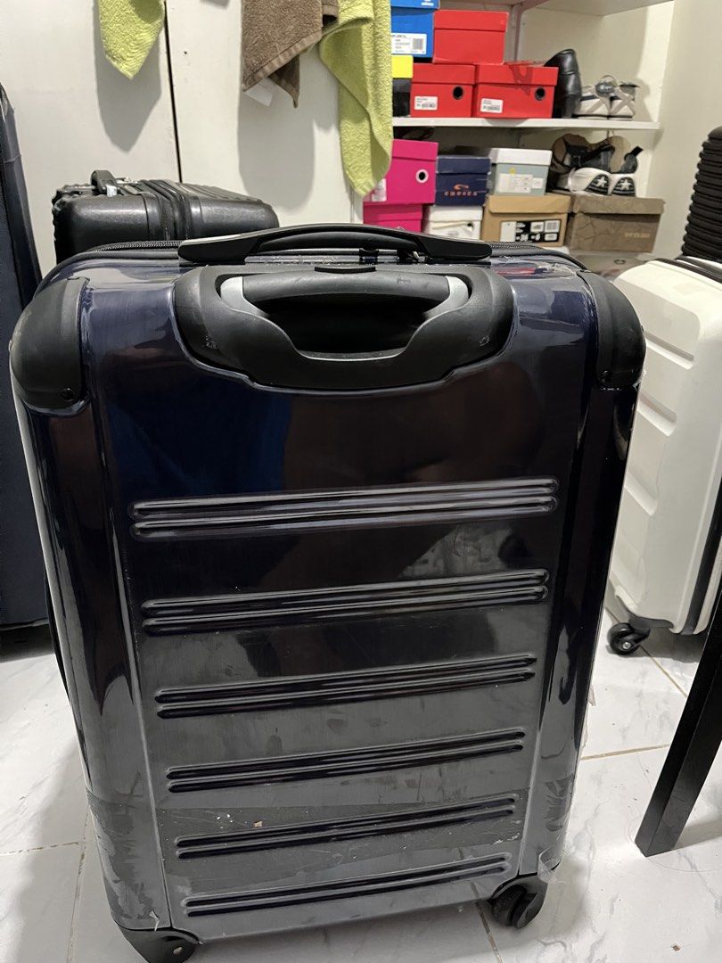 Swiss military luggage (Category: Luggage) located in Marikina City. Submitted by patpatndls (Listing ID 1470323450, Image 2). Description: - Brand: Swiss Military - Type: Hardcase Luggage / Medium Size (approx. 23-24 inches) - Color: Dark Blue / Black - Condition: 7/10 (shows minor exterior scuffs/stickers from travel, zippers and wheels work great, interior is clean) - Features: Durable hardshell exterior, secure inner cross straps, multiple zi