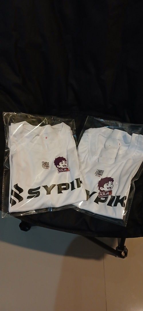 SYPIK White T-Shirt Custom Print (Category: Tshirts & Polo Shirts ) located in Manila. Submitted by kairocreativesandprints (Listing ID 1470340225, Image 2). Description: -Sizes: XS, S, M, L, XL - Brand: SYPIK - Color: White - Design: Front and sleeve graphic print - Neckline: Round neck - Sleeves: Short sleeves - Condition: Brand new, still sealed in original plastic packaging.