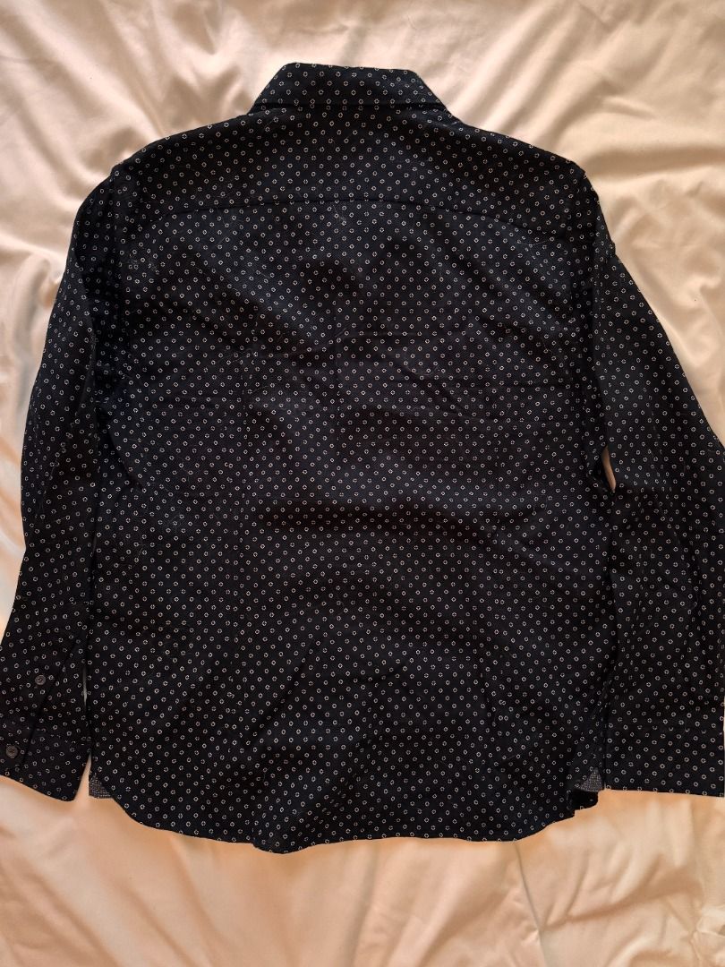 Ted Baker London geometric print button-down shirt Large (Category: Blouses) located in Cebu City. Submitted by _t.rix (Listing ID 1470186662, Image 2). Description: - Brand: Ted Baker London - Style: Men's long-sleeve button-down shirt - Color/Pattern: Dark navy blue with all-over white geometric print - Size: Tagged Size 5 (Large) - Material: 98% cotton, 2% elastane (slight stretch for comfort) - Details: Contrasting inner collar/trim with red 
