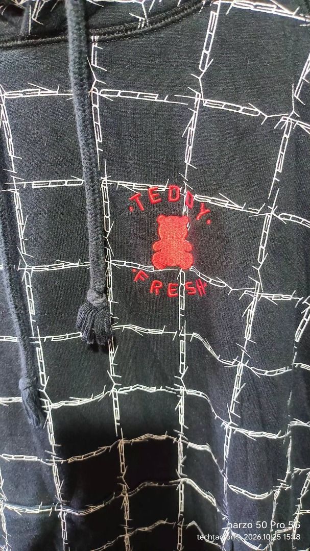 Teddy Fresh Black Barbed Wire Grid Hoodie (Category: Coats, Jackets and Outerwear) located in Santo Tomas. Submitted by pickers_corner (Listing ID 1470293873, Image 2). Description: TEDDY FRESH barbed wire grid Hoodie size L dime 23x28 excellent condition no issue - Brand: Teddy Fresh - Color: Black with white barbed wire grid pattern - Size: Large - Details: Embroidered red bear logo on left chest, drawstring hood with knotted cords - Material: 