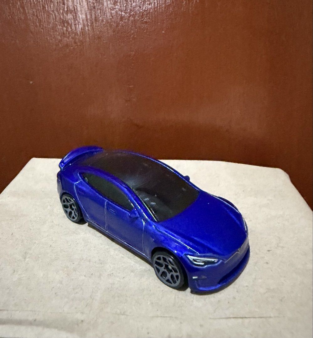 Tesla bundle (Category: Vehicle & Diecast Models) located in Manila. Submitted by stealss (Listing ID 1470194592, Image 2). Description: Tomica - Tesla Model Y Black and White (Unsealed) Hotwheels - Tesla Model S (Loose) 500 for all three Firm .
