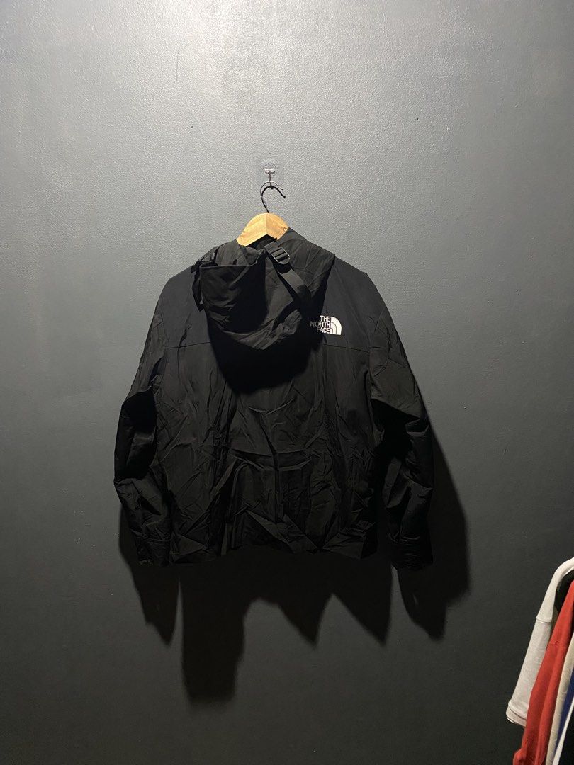 The North Face Black Gore-Tex Waterproof Jacket (Category: Coats, Jackets and Outerwear) located in Lucena. Submitted by handpickthrift (Listing ID 1470183309, Image 2). Description: - Brand: The North Face - Color: Black 22x26 dimes - Material: Gore-Tex (100% waterproof for heavy rain) - Closure: Full zip front with snap button storm flap - Hood: Adjustable with drawstrings - Cuffs: Adjustable Velcro straps - Branding: Embroidered logo on front 