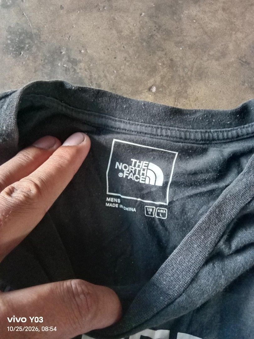 The North Face Black T-Shirt (Category: Tshirts & Polo Shirts ) located in Cabuyao City. Submitted by blake657 (Listing ID 1470150246, Image 2). Description: - Brand: The North Face - Color: Dark grey with large white logo print - Size: Men's US Medium / Asia Large - Material: 100% cotton for everyday comfort - Design: Standard crew neck, short sleeves - Condition: Brand new / Excellent casual wear piece - Origin: Made in China.