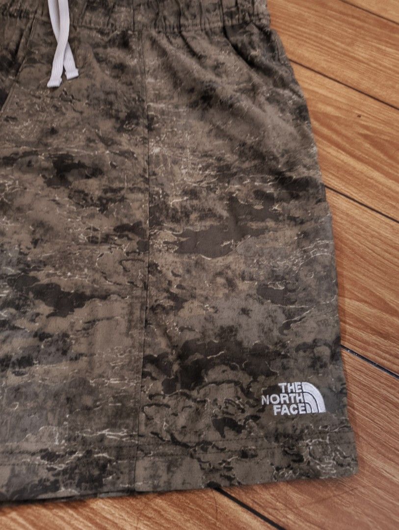 The North Face Camo Shorts (Category: Shorts) located in San Pedro. Submitted by madvillainkicks (Listing ID 1470170262, Image 2). Description: North Face camo shorts in earthy tones. Elastic waistband with adjustable white drawstring. Handy zip pocket on the back right side. White logo printed near the bottom hem. Lightweight material, great for outdoor activities or casual wear. Clean interior tags intact. waist fits 32-36 .