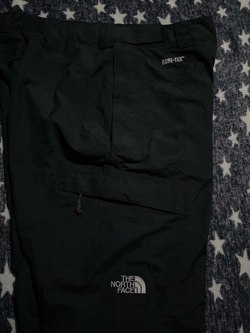 The North Face Gore-Tex Black Snow Pants (Category: Trousers) located in Manila. Submitted by ja_thrift. (Listing ID 1470195509, Image 2). Description: - Brand: The North Face - Style: Waterproof Gore-Tex snow pants - Color: Solid black - Size: Medium - Country of Origin: Bangladesh - Material: 100% nylon shell with Gore-Tex ePTFE membrane and polyester lining - Closure: Button closure with zip fly - Pockets: Front cargo pocket with pull cord - D