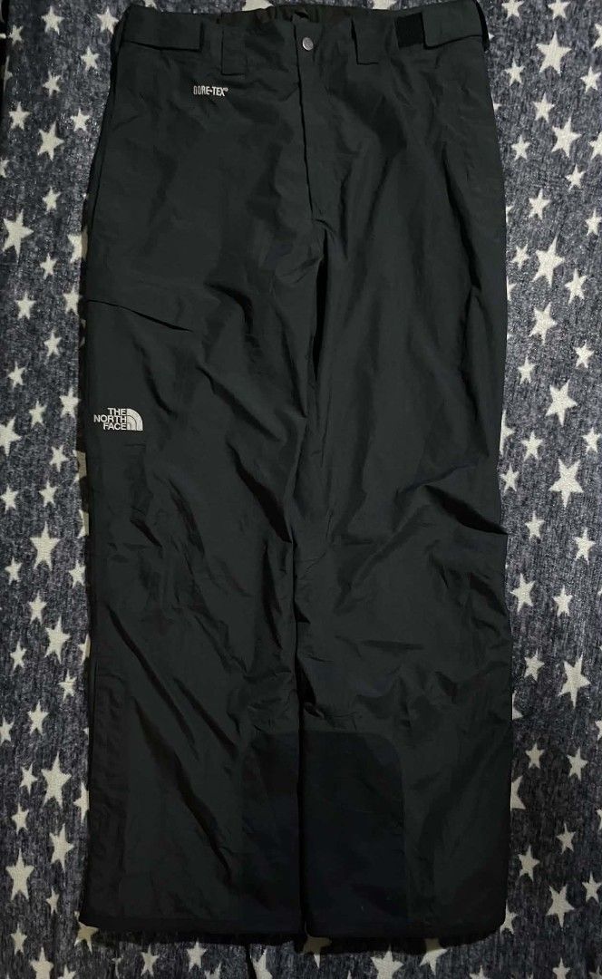 The North Face Gore-Tex Black Snow Pants (Category: Trousers) located in Manila. Submitted by ja_thrift. (Listing ID 1470195509, Image 1). Description: - Brand: The North Face - Style: Waterproof Gore-Tex snow pants - Color: Solid black - Size: Medium - Country of Origin: Bangladesh - Material: 100% nylon shell with Gore-Tex ePTFE membrane and polyester lining - Closure: Button closure with zip fly - Pockets: Front cargo pocket with pull cord - D