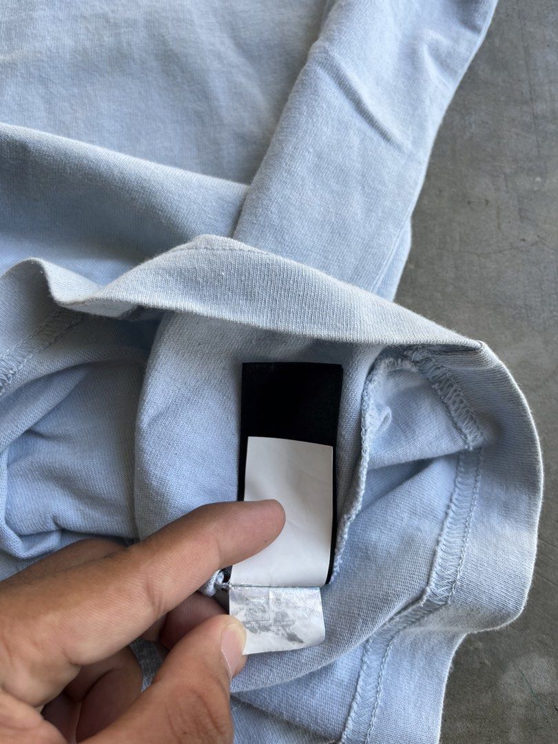 The North Face Puffer Jacket Pocket Tee Light Blue (Category: Coats, Jackets and Outerwear) located in Dipaculao. Submitted by _jzx.ph4lxfe (Listing ID 1470215507, Image 3). Description: - Brand: The North Face - Color: Light Blue - Style: Crew neck casual short sleeve tee with standard fit - Details: Chest pocket with unique embroidered puffer jacket graphic and small black brand tag on the side seam - Condition: Brand new / Excellent - Mode of 