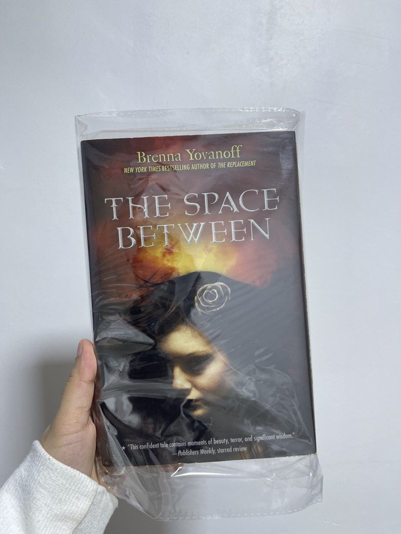 The Space Between by Brenna Yovanoff Novel (Category: Storybooks) located in Bulacan. Submitted by aglqx (Listing ID 1470329273, Image 1). Description: - Title: The Space Between by Brenna Yovanoff - Genre: Young adult supernatural fiction / dark fantasy - Format: Paperback, protected with a clear plastic cover - Condition: Clean cover art with minor yellowish toning on the page edges due to age/storage, has foxing - Perfect addition for book col