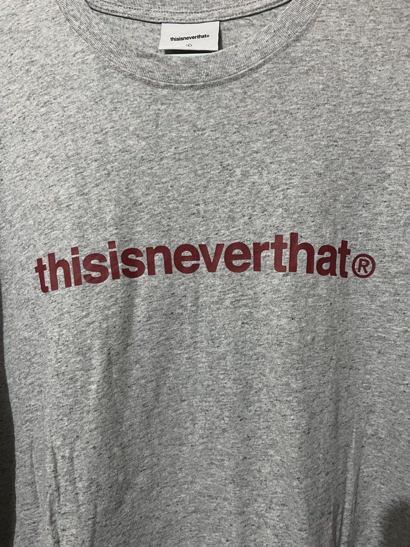 Thisisneverthat Grey T-Shirt Size L (Category: Tshirts & Polo Shirts ) located in Baguio. Submitted by visentovi (Listing ID 1470302138, Image 2). Description: - Brand: thisisneverthat - Color: Grey heather with dark red logo - Size: L - Material: Cotton blend - Fit: Standard crew neck - Details: Interior care labels intact, style code TN250TTSST01, made in China - Condition: Good quality streetwear piece.