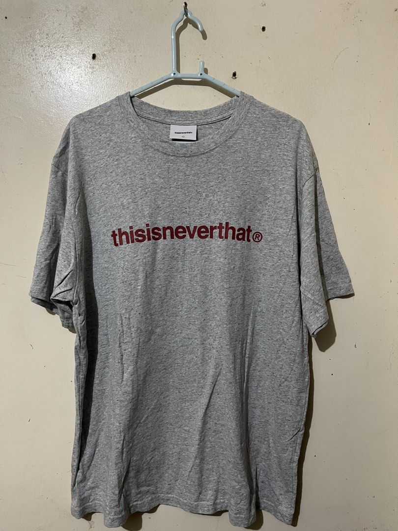 Thisisneverthat Grey T-Shirt Size L (Category: Tshirts & Polo Shirts ) located in Baguio. Submitted by visentovi (Listing ID 1470302138, Image 1). Description: - Brand: thisisneverthat - Color: Grey heather with dark red logo - Size: L - Material: Cotton blend - Fit: Standard crew neck - Details: Interior care labels intact, style code TN250TTSST01, made in China - Condition: Good quality streetwear piece.