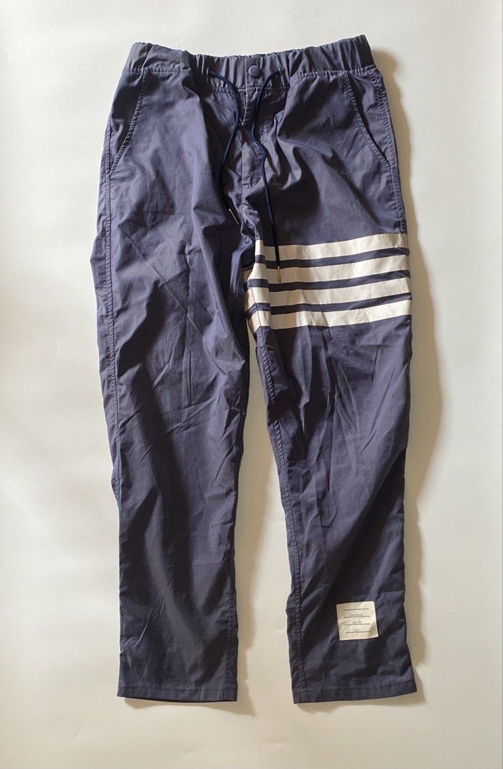 Thom Browne 4 Bar Track Pants (Category: Joggers) located in Manila. Submitted by finofindthisart (Listing ID 1470253143, Image 2). Description: Length 37 Waist 32-34 Hem y Measured it by inches Issue: N/A This is a pre-loved/thrifted items and may show minor signs of issue due to its vintage nature. Kindly manage expectations. No refunds or exchanges will be accepted. 📍Pasay City DM for inquiries..