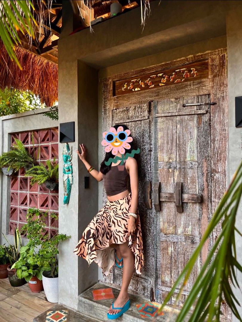 Tiger print asymmetric midi skirt (Category: Skirts) located in Macabebe. Submitted by cheeseoreo (Listing ID 1470195590, Image 2). Description: xs on tag 26" waist | 30" length (uneven hem line) model is 5'4" / 26" waist - soft fabric - zipper on side 📍Pampanga 🛻 J&T.