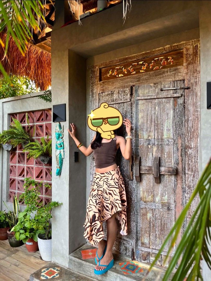 Tiger print asymmetric midi skirt (Category: Skirts) located in Macabebe. Submitted by cheeseoreo (Listing ID 1470195590, Image 1). Description: xs on tag 26" waist | 30" length (uneven hem line) model is 5'4" / 26" waist - soft fabric - zipper on side 📍Pampanga 🛻 J&T.