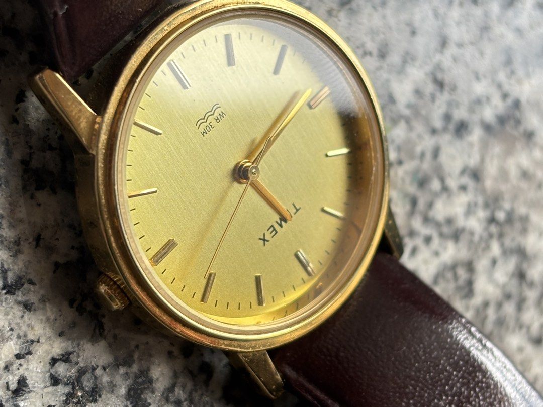 Timex Gold Tone Watch with Brown Leather Strap (Category: Women's Watches) located in Taguig. Submitted by nisse (Listing ID 1470166425, Image 2). Description: RFS NEED FUNDS FOR MEDICINE BOUGHT THIS YEAR WITH BOX AND WARRANTY 1 yr TAGUIG LOC LAST PRICE DO NOT LOW BALL PO - Brand: Timex - Style: Classic minimalist gold-tone wristwatch - Dial: Brushed golden dial with clean crystal - Movement: Battery-operated quartz movement - Water Resistance: W