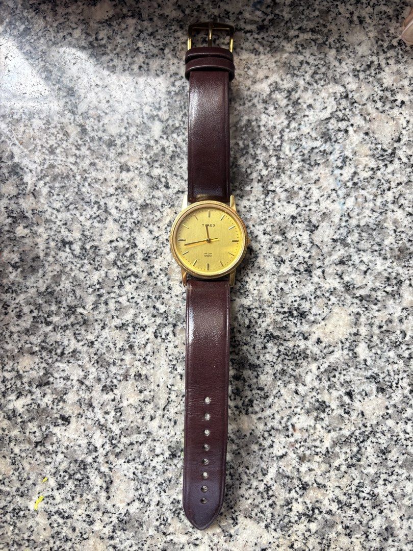 Timex Gold Tone Watch with Brown Leather Strap (Category: Women's Watches) located in Taguig. Submitted by nisse (Listing ID 1470166425, Image 1). Description: RFS NEED FUNDS FOR MEDICINE BOUGHT THIS YEAR WITH BOX AND WARRANTY 1 yr TAGUIG LOC LAST PRICE DO NOT LOW BALL PO - Brand: Timex - Style: Classic minimalist gold-tone wristwatch - Dial: Brushed golden dial with clean crystal - Movement: Battery-operated quartz movement - Water Resistance: W