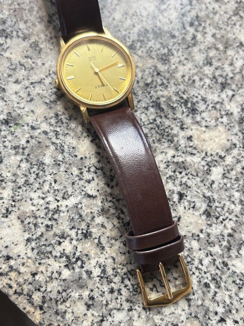 Timex Gold Tone Watch with Brown Leather Strap (Category: Women's Watches) located in Taguig. Submitted by nisse (Listing ID 1470166425, Image 3). Description: RFS NEED FUNDS FOR MEDICINE BOUGHT THIS YEAR WITH BOX AND WARRANTY 1 yr TAGUIG LOC LAST PRICE DO NOT LOW BALL PO - Brand: Timex - Style: Classic minimalist gold-tone wristwatch - Dial: Brushed golden dial with clean crystal - Movement: Battery-operated quartz movement - Water Resistance: W