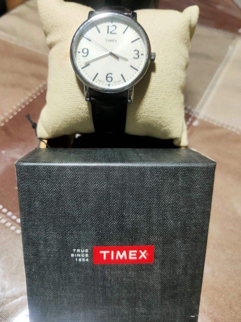 Timex Indiglo Watch with Dark Brown Leather Strap (Category: Men's Watches) located in Manila. Submitted by jhs31 (Listing ID 1470307314, Image 1). Description: - Brand: Timex - Dial: Off-white with bold black numbers and signature Indiglo night-light - Strap: Dark brown genuine leather with stylish contrast stitching and silver-tone buckle - Water Resistance: Up to 30 meters - Inclusions: Original black Timex display box, watch cushion, and hang