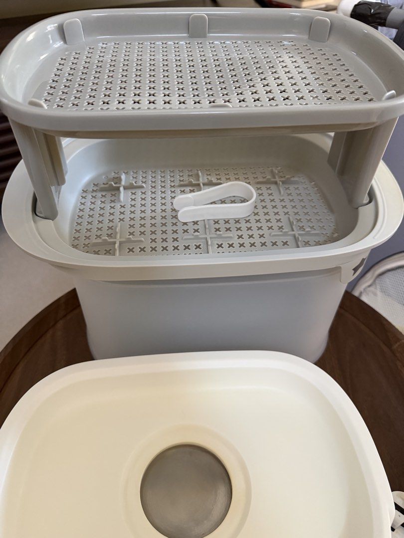 Tommee Tippee Electric Bottle Steriliser (Category: Breastfeeding & Bottle Feeding) located in Taguig. Submitted by enabee (Listing ID 1470213338, Image 3). Description: - Brand: Tommee Tippee Electric Steam Steriliser - Condition: Clean and well-maintained heating plate - Includes: Base unit, transparent cover, two-tier rack, and tongs - Features: Simple one-button operation, side reminder sticker, and bottom cable wrap - Plug type: Standard UK 