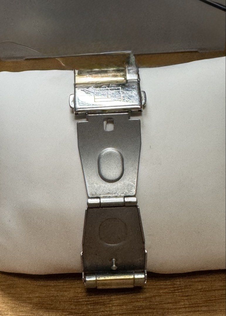 Tommy Hilfiger Rectangular Two-Tone Watch with Box and Manual (Category: Women's Watches) located in Valenzuela. Submitted by wisetree_18aeb6 (Listing ID 1470206872, Image 3). Description: - Brand: Tommy Hilfiger - Design: Rectangular case with a textured white dial, Roman numerals, and date display - Strap: Two-tone silver and gold metal bracelet with a deployment clasp - Details: Gold crown, elegant and classic everyday wear - Inclusions: Origi