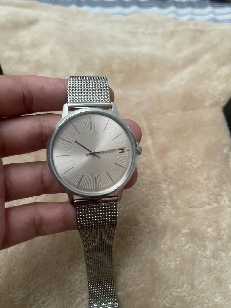 Tommy Hilfiger Silver Mesh Watch 1782244 (Category: Women's Watches) located in Cavite. Submitted by vastowl_7d1ce5 (Listing ID 1470164097, Image 2). Description: - Brand: Tommy Hilfiger - Model: 1782244 - Color: Silver-tone - Dial: Sunburst texture with minimalist markers and logo - Strap: Stainless steel mesh with adjustable clasp - Condition: Clean crystal and polished bezel - Inclusions: Original branded box, tag, and display cushion - Ideal 