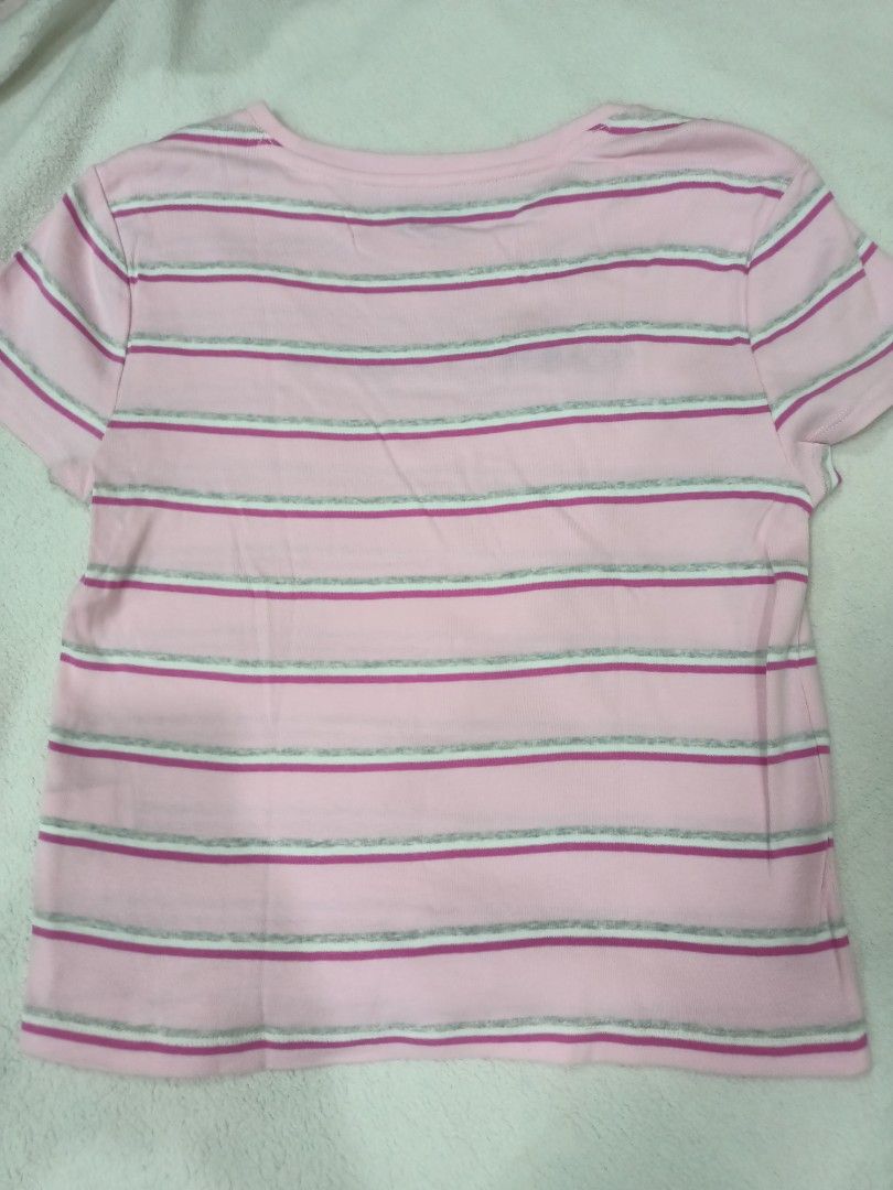 Tommy Jeans Pink Striped Tee Size L (Category: Shirts) located in Manila. Submitted by jollynest24 (Listing ID 1470282475, Image 3). Description: - Brand: Tommy Jeans - Colorway: Pink, white, and grey stripes - Size: L / G - Design: Classic crew neck, short sleeves, and embroidered chest logo - Origin: Made in India - Location : Sampaloc Manila - Gcash ( MOP).