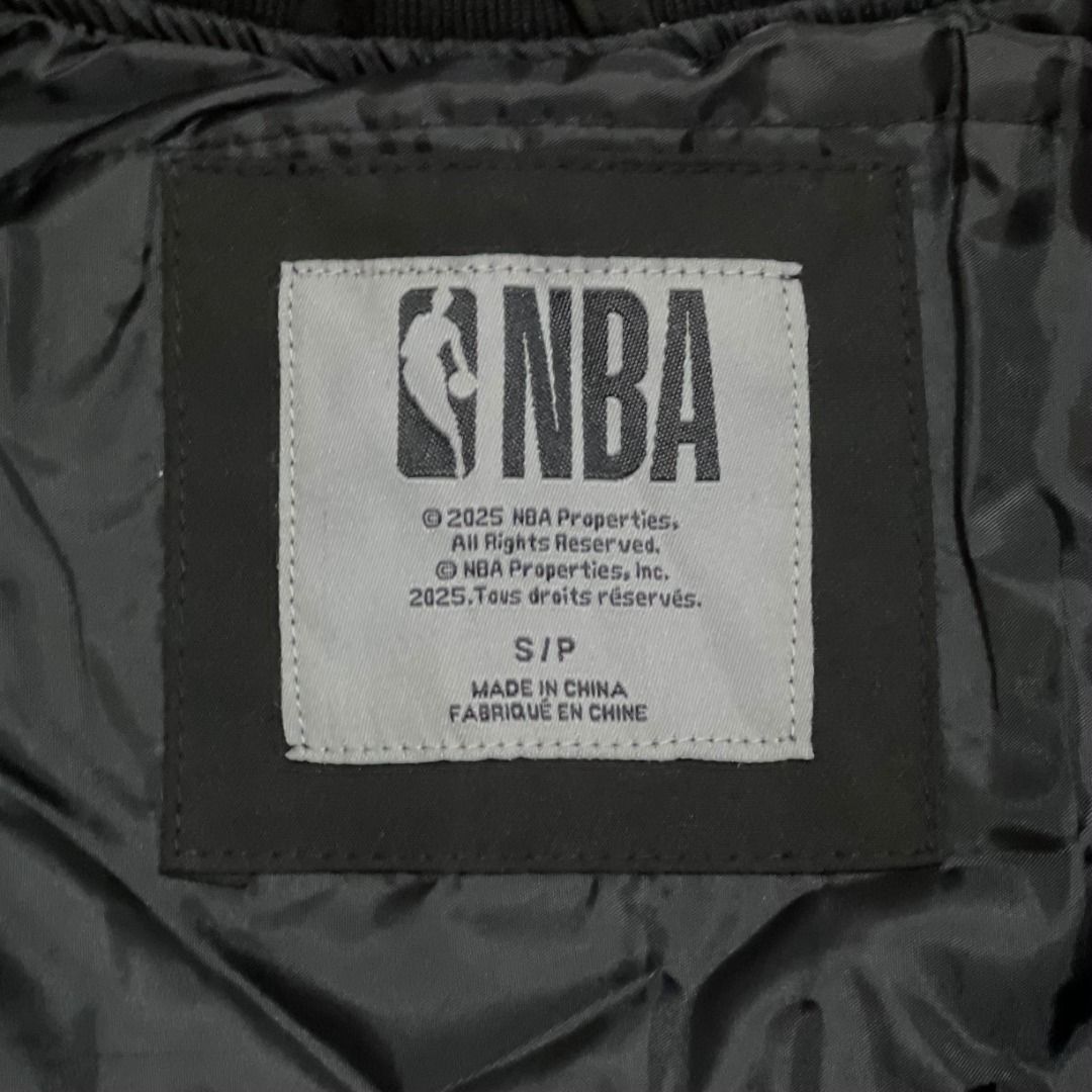 Toronto Raptors NBA Bomber Jacket Black Size S (Category: Coats, Jackets and Outerwear) located in Manila. Submitted by luxurybagsandshoes (Listing ID 1470232231, Image 3). Description: - Item: Brand New Toronto Raptors Varsity Jacket - Size: Small (with original tags attached) - Closure & Trim: Snap-button front with striped collar, cuffs, and hem - Design Details: Embroidered 'RAPTORS' lettering on the chest and a large graphic on the back - Sp