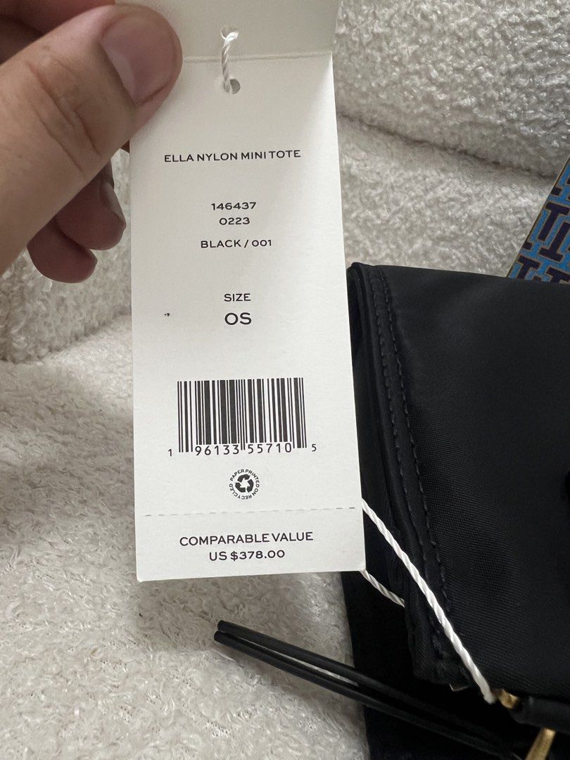 Tory Burch Ella Nylon Mini Tote Black (Category: Tote Bags) located in Abulug. Submitted by jamiecammie (Listing ID 1470273019, Image 2). Description: - Authentic Tory Burch Ella Nylon Mini Tote in classic black - Compact OS size with durable nylon body and leather handles - Brand new and unused, with protective wrapping still intact on handles and strap - Comes complete with a detachable strap and shopping bag.