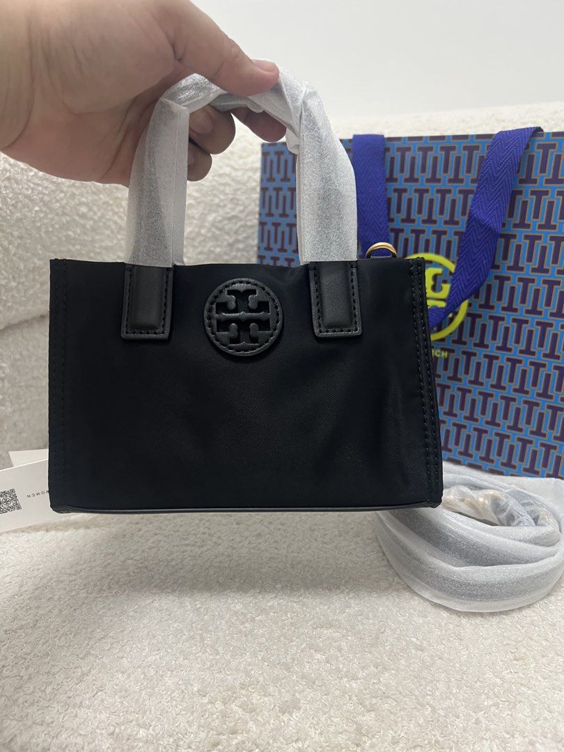 Tory Burch Ella Nylon Mini Tote Black (Category: Tote Bags) located in Abulug. Submitted by jamiecammie (Listing ID 1470273019, Image 3). Description: - Authentic Tory Burch Ella Nylon Mini Tote in classic black - Compact OS size with durable nylon body and leather handles - Brand new and unused, with protective wrapping still intact on handles and strap - Comes complete with a detachable strap and shopping bag.