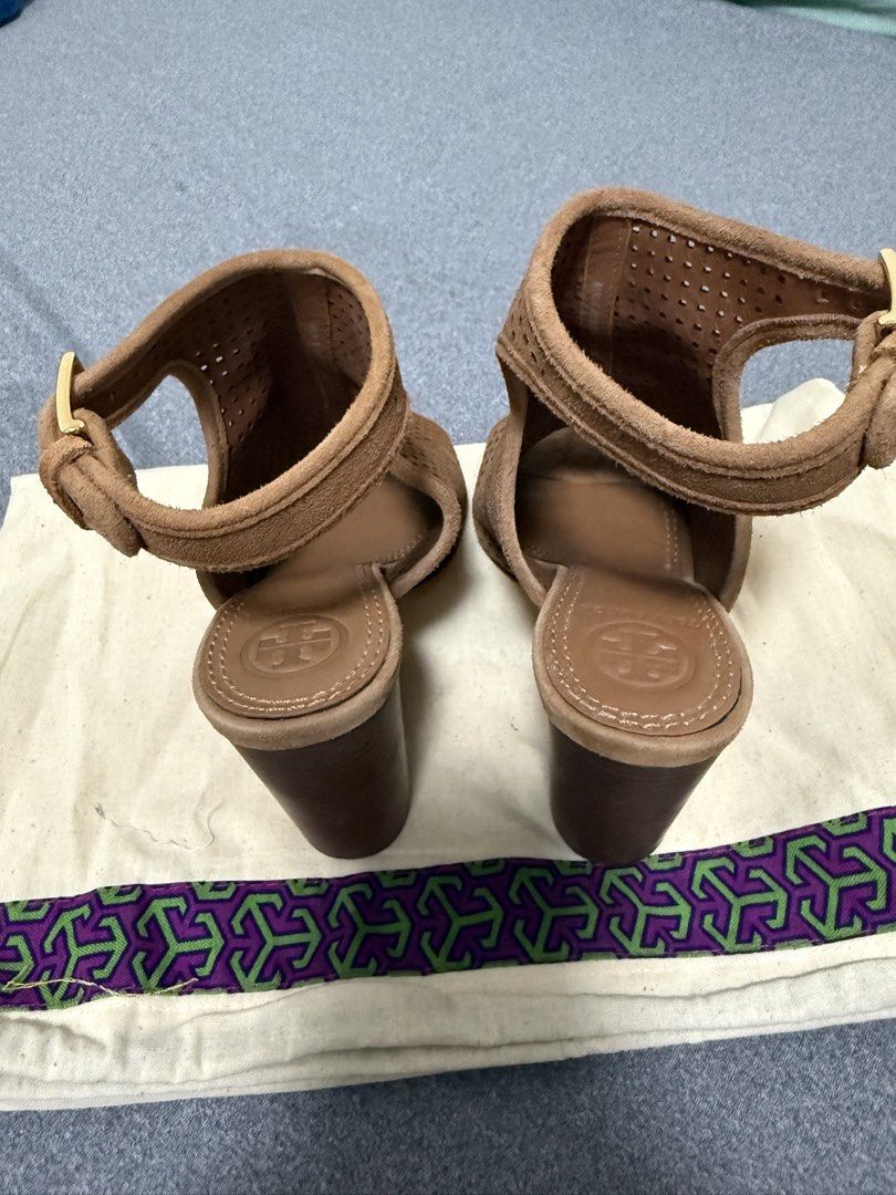 Tory Burch "Jesse" Perforated Suede Booties (Category: Boots) located in Angeles City. Submitted by missluxxe888 (Listing ID 1470347682, Image 3). Description: Key Specifications & Design Details Size US 5.5 • Material: Fine, velvety suede upper, typically lined with leather. • Perforations: Fully detailed with geometric diamond-patterned cutouts along the vamp and sides. • Toe Style: Peep-toe / Open-toe design. • Heel: Approximately a 4-inch chu