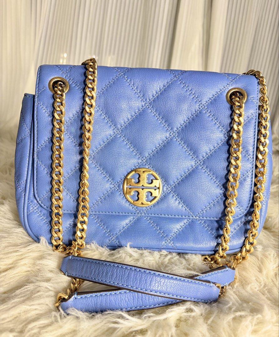 Tory Burch Quilted Leather Convertible Shoulder Bag (Category: Luxury Bags & Wallets) located in Angeles City. Submitted by simplycatchy (Listing ID 1470164351, Image 1). Description: - Brand: Tory Burch - Style: Quilted shoulder bag - Color: Soft periwinkle blue - Material: Premium leather with diamond quilting - Hardware: Gold-tone chain strap with leather guards and iconic Double T logo - Closure: Secure magnetic snap - Compartments: Clean int