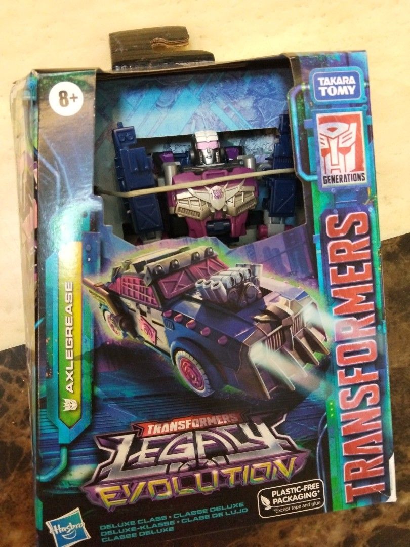 Transformers Legacy Evolution Axlegrease Deluxe Class Figure (Category: Toy Figures) located in Singapore. Submitted by snowstream (Listing ID 1470276308, Image 1). Description: - Brand: Hasbro / Takara Tomy (Generations series) - Character: Axlegrease (Deluxe Class) - Transformation: 17 steps from robot mode to rugged street vehicle - Condition: Brand new, unopened packaging with minor shelf wear on the top hang tab - Perfect addition for Transf