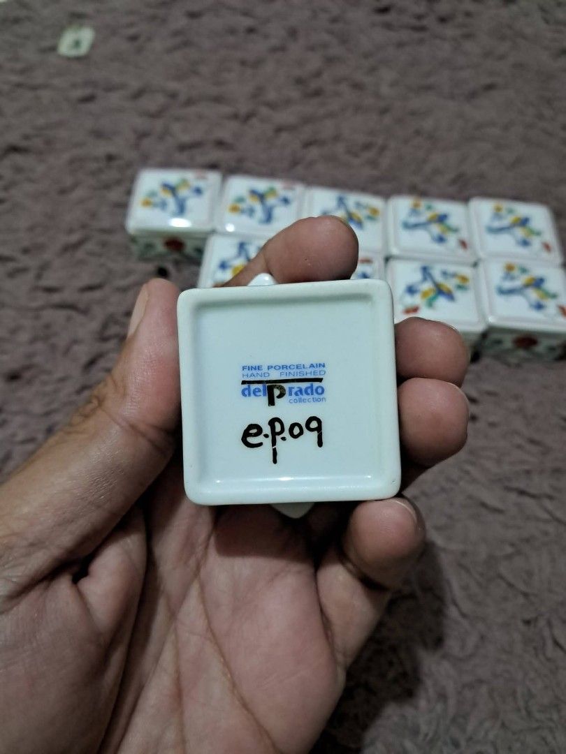 Trinket (Category: Vintage Collectibles) located in Cavite. Submitted by secretjapansurplus (Listing ID 1470203759, Image 3). Description: 19 pcs available Vintage Del Prado Fine Porcelain Trinket Box (Design No. EP09) For sale: Miniature square porcelain trinket/pill boxes with loose lids. This collectible item is from the Del Prado Collection, Spain, showcasing a vibrant Japanese-inspired bird and floral motif. Brand/Origin: Del Prado (Spain) M