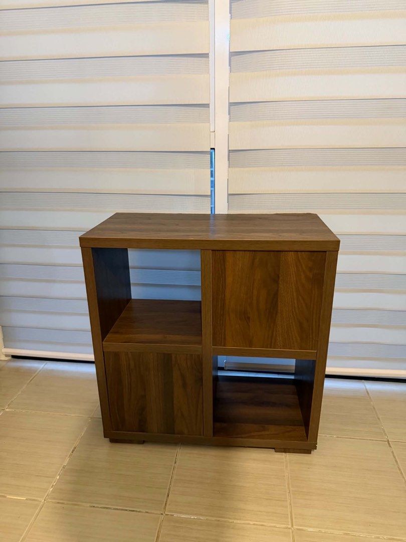 TV Cabinet (Category: Shelves, Cabinets & Racks) located in Mandaluyong City. Submitted by artyreal (Listing ID 1470245584, Image 3). Description: - Elegant dark wood finish - 4 spacious compartments total - 2 open shelves for easy access - 2 enclosed cabinets with matching wooden doors to hide clutter - Sturdy rectangular base for stability - Compact size ideal for living rooms, bedrooms, or home offices - Condition: Excellent / Ready for pickup