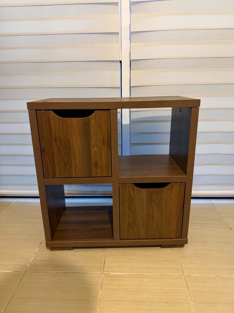 TV Cabinet (Category: Shelves, Cabinets & Racks) located in Mandaluyong City. Submitted by artyreal (Listing ID 1470245584, Image 2). Description: - Elegant dark wood finish - 4 spacious compartments total - 2 open shelves for easy access - 2 enclosed cabinets with matching wooden doors to hide clutter - Sturdy rectangular base for stability - Compact size ideal for living rooms, bedrooms, or home offices - Condition: Excellent / Ready for pickup