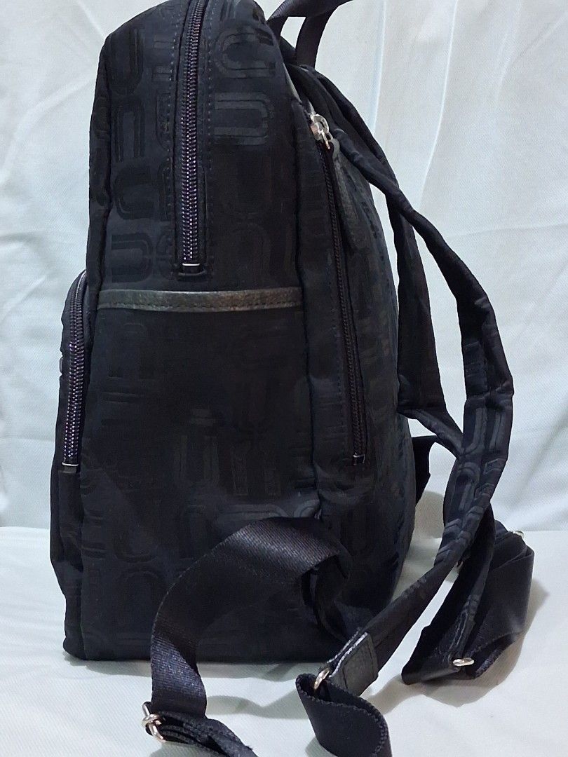 U by Ungaro Black Monogram Nylon Backpack ( FREE SHIPPING ) (Category: Luxury Bags & Wallets) located in Hinigaran. Submitted by faye_fab (Listing ID 1470196569, Image 3). Description: - Brand/Model: Authentic U by Ungaro black nylon backpack - Design: Chic all-over monogram print on both exterior and lining - Storage: Front and back exterior zip pockets, plus an interior zip compartment - Comfort & Portability: Adjustable shoulder straps and a s
