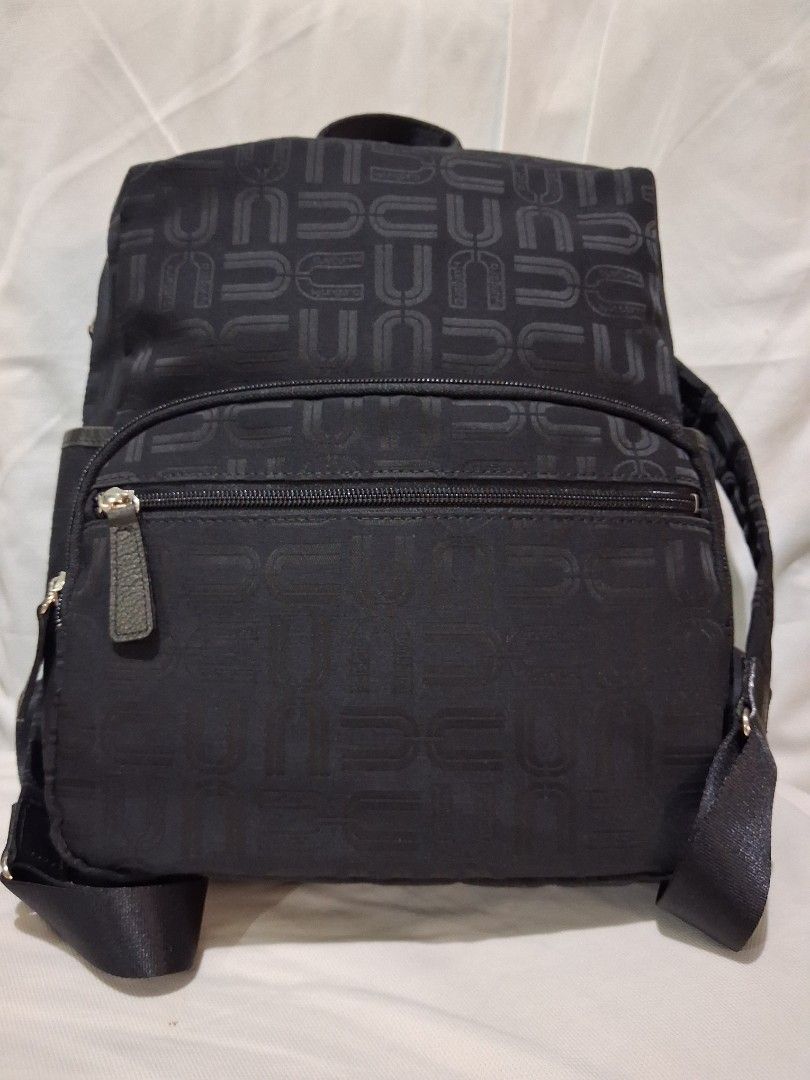 U by Ungaro Black Monogram Nylon Backpack ( FREE SHIPPING ) (Category: Luxury Bags & Wallets) located in Hinigaran. Submitted by faye_fab (Listing ID 1470196569, Image 1). Description: - Brand/Model: Authentic U by Ungaro black nylon backpack - Design: Chic all-over monogram print on both exterior and lining - Storage: Front and back exterior zip pockets, plus an interior zip compartment - Comfort & Portability: Adjustable shoulder straps and a s