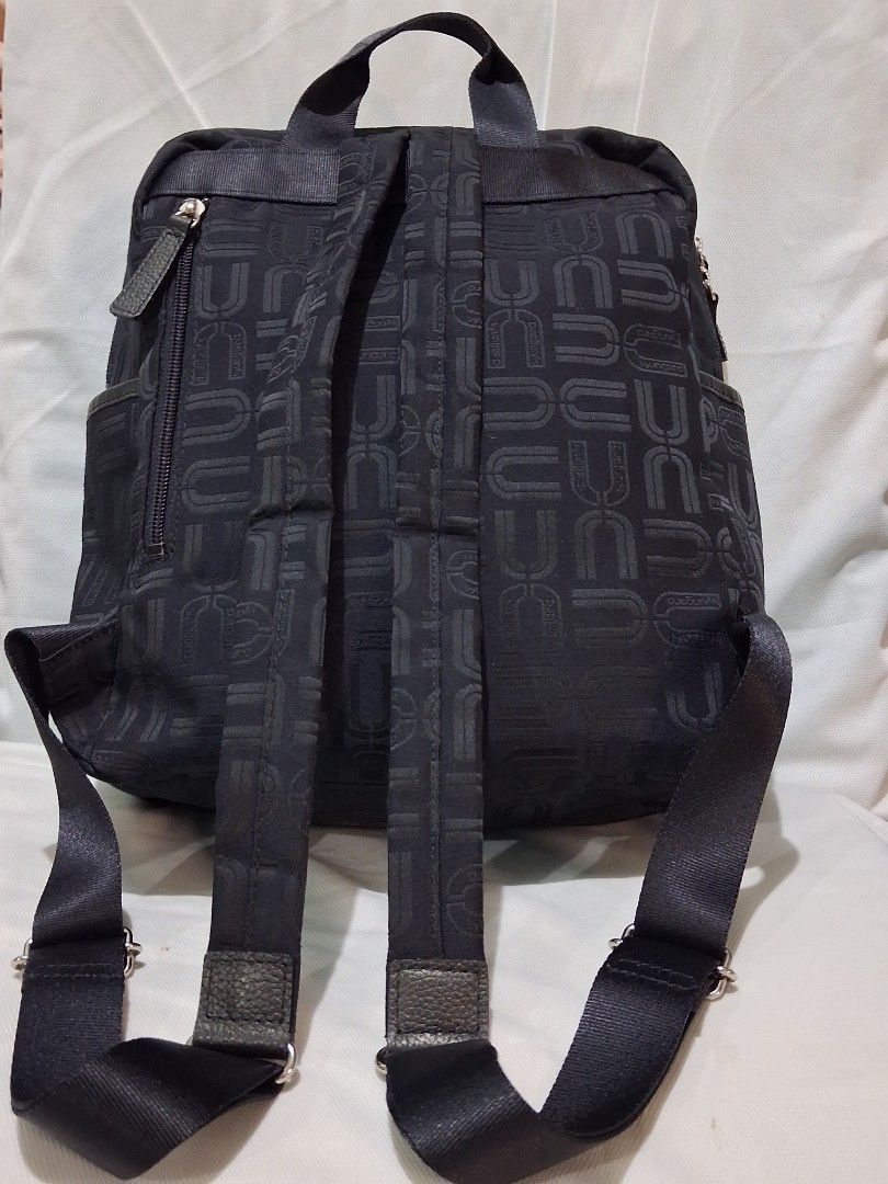 U by Ungaro Black Monogram Nylon Backpack ( FREE SHIPPING ) (Category: Luxury Bags & Wallets) located in Hinigaran. Submitted by faye_fab (Listing ID 1470196569, Image 2). Description: - Brand/Model: Authentic U by Ungaro black nylon backpack - Design: Chic all-over monogram print on both exterior and lining - Storage: Front and back exterior zip pockets, plus an interior zip compartment - Comfort & Portability: Adjustable shoulder straps and a s
