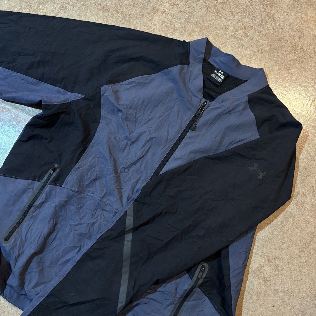 Under Armour Sport Jacket XL Blue Black (Category: Coats, Jackets and Outerwear) located in Dipolog. Submitted by dionato (Listing ID 1470286298, Image 2). Description: - Brand: Under Armour - Size: XL - Color: Blue and black - Origin: Made in the Philippines - Material: Lightweight with mesh inner lining - Features: Stand collar, full front zipper, and secure zip pockets on both sides.