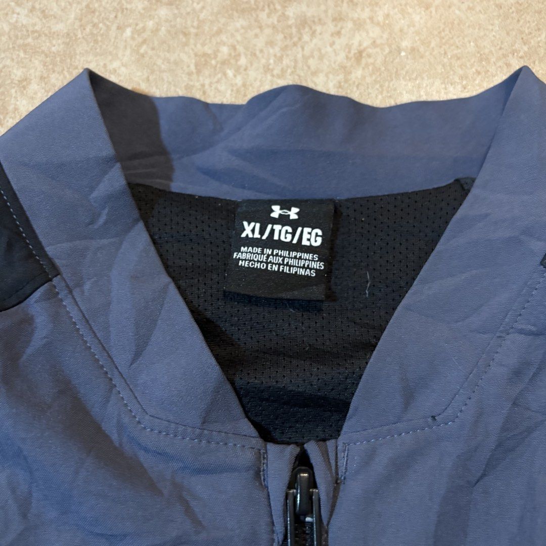 Under Armour Sport Jacket XL Blue Black (Category: Coats, Jackets and Outerwear) located in Dipolog. Submitted by dionato (Listing ID 1470286298, Image 3). Description: - Brand: Under Armour - Size: XL - Color: Blue and black - Origin: Made in the Philippines - Material: Lightweight with mesh inner lining - Features: Stand collar, full front zipper, and secure zip pockets on both sides.