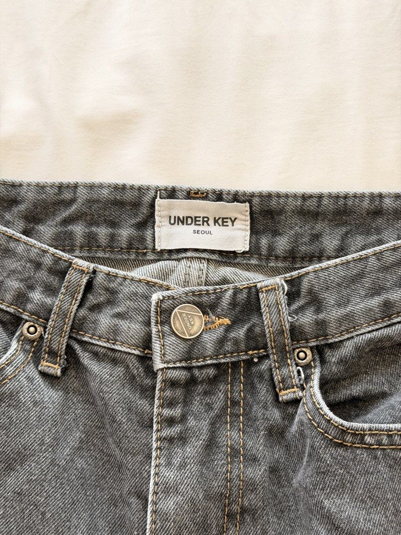 Under Key Seoul Dark Grey Denim Jeans (Category: Jeans) located in Makati City. Submitted by banshee1411 (Listing ID 1470259475, Image 2). Description: Dark grey wash denim straight from Seoul. Brand tag shows Under Key. Size 27.
