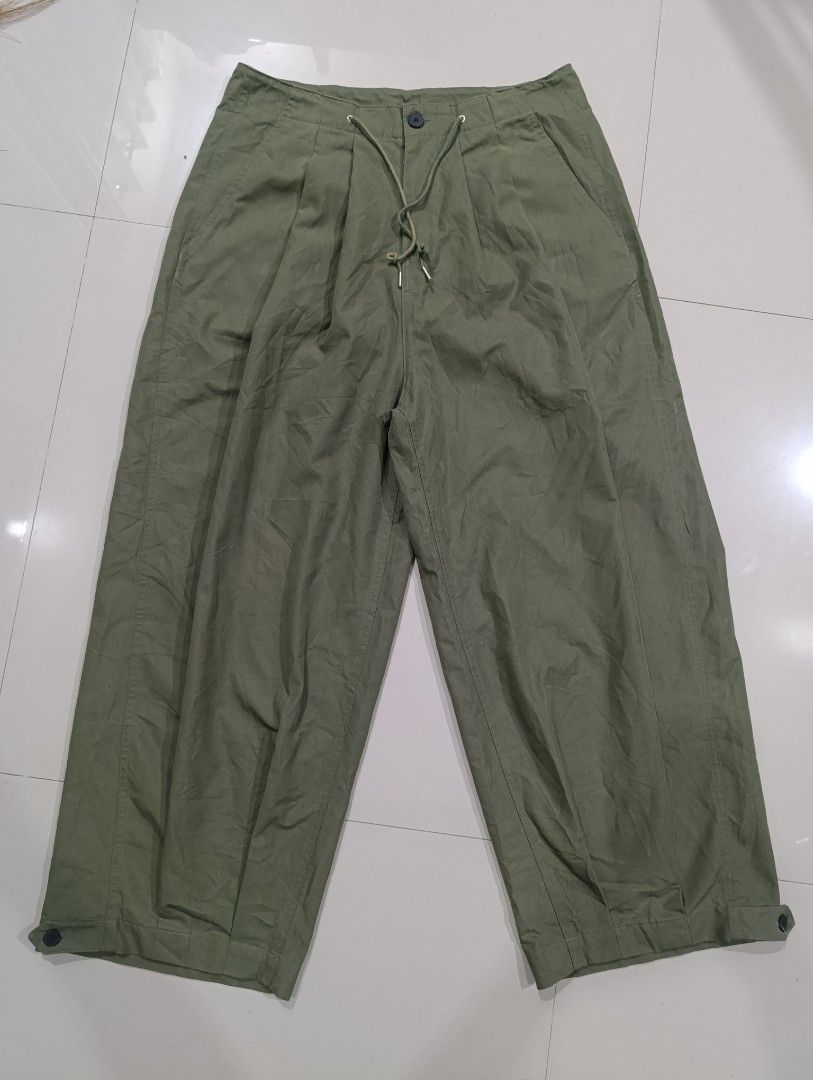 Uniform Bridge Balloon Pants Sage Green Size M (Category: Trousers) located in Davao. Submitted by idioticthrifter (Listing ID 1470331918, Image 2). Description: - Brand/Model: Uniform Bridge Balloon Pants - Color: Sage Green - Size: Medium (fits size 30 waist) - Material: 65% cotton, 35% polyester - Fit: Wide leg silhouette with front pleats - Waist: Convenient drawstring waist - Cuffs: Adjustable button cuffs at the hem - Pockets: Classic back 