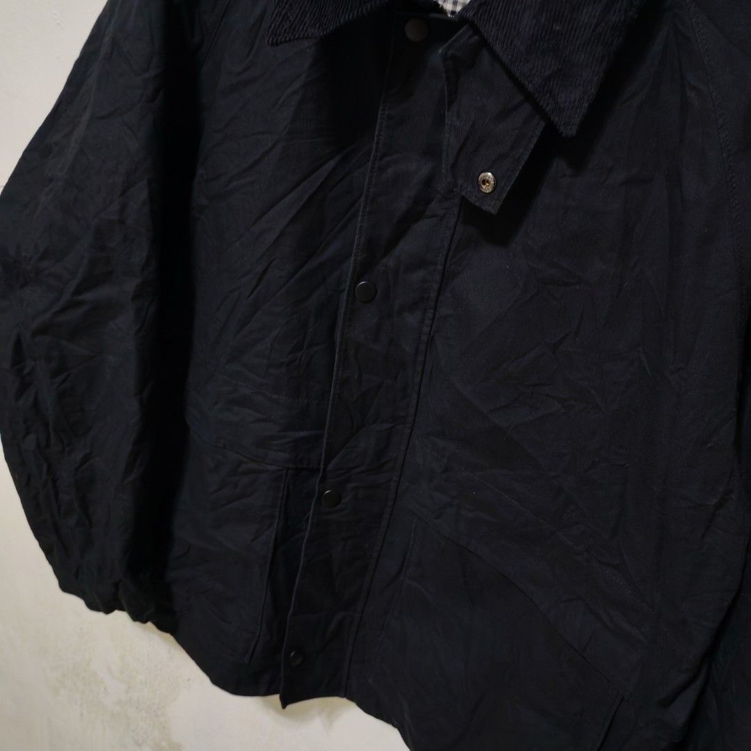 Uniqlo Black Corduroy Collar Utility Jacket (Category: Coats, Jackets and Outerwear) located in Manila. Submitted by ryandip88861707 (Listing ID 1470267749, Image 3). Description: - Brand: Uniqlo - Color: Classic Black with contrasting corduroy collar - Interior: Vintage-inspired plaid lining - Closure: Full zip front with snap-button storm flap - Pockets: Convenient front patch pockets for daily essentials - Fit: Clean silhouette, perfect for la